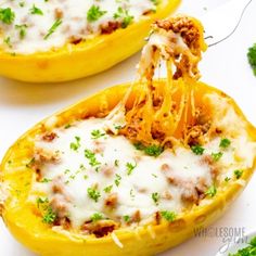 spaghetti being lifted from the inside of a stuffed bell peppers