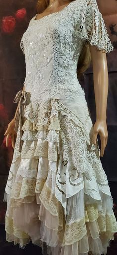 This beautiful alternative, layered, all lace gown has been created around an original 1940's leavers lace blouse. A multitude of layers including soft and firm tulle, silk, satin, and antique and vintage lace have been meticulously crafted into a beautiful full asymmetrical skirt.   This dress would suit a lady sized 8-10 Aus.   Please check measurements below for an accurate fit prior to purchase.   Measurements:   (laying flat- double for circumference) Bust: 16.5' Waist: 14.5' Hip: 15.5' Length to hem: 47'  The tie back will allow for 1-2 inchs extra but this dress is fitted so please check and re-check your sizing or contact me to see if it will fit perfectly!  I have also made a modesty panel that clips into the back of the skirt section for a little extra coverage if required. This Wedding Gown Fairytale, Gown Fairytale, Lace Layered Dress, Alternative Wedding Gown, Meat Dress, Boho Style Wedding Dress, Dress Alternative, Full Gown, Altered State