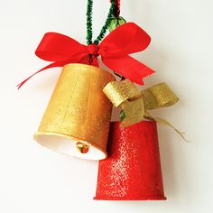 two red and gold christmas decorations with bells