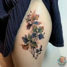 a woman's thigh with leaves on it