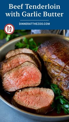 beef tenderion with garlic butter in a bowl