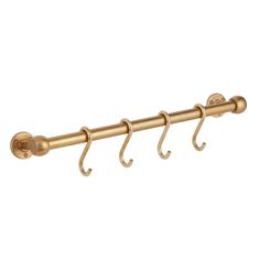 three brass hooks are attached to the side of a curtain rod, with two handles on each