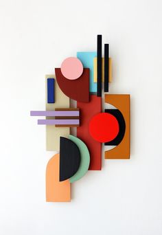 an abstract painting with different colors and shapes on the wall in front of a white background