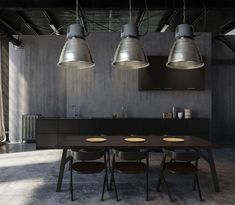 an industrial style kitchen and dining room are featured in this image with three pendant lights hanging over the table