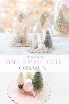 an ornament with snowmen and trees under glass domes on a white table