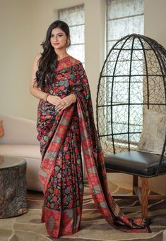 Black Kani saree in silk fabric is accentuated with all over  Kani weaving  in alluring floral motifs and beautiful color palette. A touch of zari thread adds a hint of shine to enhance these motifs, while contrasting border and pallu add some more color to this stunning saree. It is accompanied with Kani blouse piece in contrasting colour. The design inspiration for this Pashmina Silk saree is drawn from the heritage weaves of ancient Pashmina shawls from Kashmir that date back to the Mughal er Anarkali Style Multicolor Slub Silk Pre-draped Saree, Multicolor Slub Silk Blouse Piece With Zari Weaving, Festive Pashmina Traditional Wear With Zari Weaving, Multicolor Slub Silk Saree With Traditional Drape, Festive Banarasi Silk Saree With Kalamkari Print, Elegant Multicolor Saree With Kalamkari Print, Festive Silk Saree With Kalamkari Print, Traditional Pre-draped Saree With Floral Print For Designer Wear, Traditional Drape Saree With Floral Print For Festivals