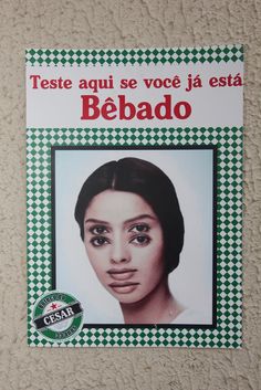 a poster on the side of a wall with a woman's face in spanish