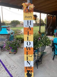 a wooden sign that says happy halloween with a black cat on it and the words'happy halloween '