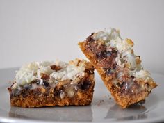 two pieces of dessert sitting on top of a white plate