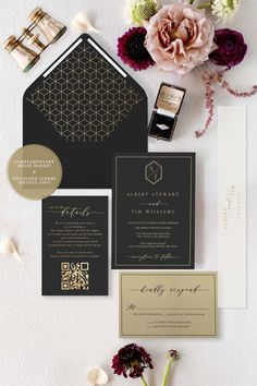 the wedding stationery is laid out with flowers and cards