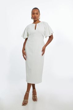 Feel Formal In Our Plus Size Midi Dress, Which Boasts A Figure Hugging Fit, A Classic Pencil Style, A Uniquely Notched Neckline, And Ruffled Sleeves. Style It With Court Heels Or Loafers For A Look That Will Take You From Date Nights To Office Days. Plus Size Structured Crepe Ruffle Sleeve Tailored Midi Pencil Dress High Quality Stretchy Crepe Fabric Figure Hugging Fit Sleek, Minimal Design Slender V Neckline Unique Ruffle Sleeves Expertly Designed For Those Uk Size 18/Us Size 14 And Above, Our Cream Sheath Midi Dress For Work, White Midi Dress With Structured Shoulders For Work, Fitted Off White Midi Dress For Workwear, Plus Size Red Dress, Hen Do Outfits, Graduation Attire, Bride Jumpsuit, Plus Size Midi Dress, Petite Wedding Guest Dresses