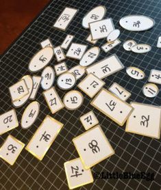 the letters and numbers are laid out on the table