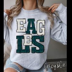 New Eagles Shirt, perfect for game days! T-Shirts are Gildan Softstyle and Sweatshirts are Gildan Heavy Blend, see size chart in listing photos. Materials used DTF and Commercial grade heat pressed. Please keep in mind colors may vary from different phone/computer screens.  Please refer to size charts all shirts/sweatshirts are unisex. Sizing available Unisex Small-3XL, if your questioning a size we recommend measuring a favorite shirt and compare so that you ensure your ordering the correct size. Production-i can usually have these pressed and in the mail within 3-5 business days. Shipping is USPS first class but if you need a rush/expedited shipping please don't hesitate to message me and we can get your order right out to you!  If you have any questions please feel free to message me, T Eagle Football Shirts Ideas, School Spirit Shirts Eagles, Team Spirit T-shirt For Game Day In Winter, Sports Fan Green Tops With Letter Print, Green Sports Fan Tops With Letter Print, Winter Fan Gear Graphic T-shirt, Winter Team Spirit T-shirt With Graphic Print, Winter Team Spirit Graphic T-shirt, Winter Team Spirit Graphic Print Tops