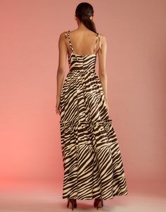 Zebra v-neck silk maxi dress. V-neck Adjustable tie straps Mid ruffle flounce hem Maxi length Invisible zipper Partial lined Fabric content: 100% silk Care instructions: dry clean only Fit: Model is 5'9" and wear a size S. Size S measurements: Length from shoulder: 52" Complete the look: Vegan Studded Leather Coat FINAL SALE Zebra Dress, Silk Maxi, Holiday Party Outfit, Silk Maxi Dress, Studded Leather, Cynthia Rowley, Tie Dress, Tiered Dress, Invisible Zipper