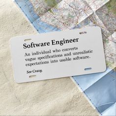 there is a sign that says software engineer on the front and back of some maps