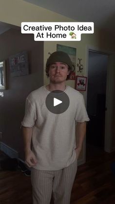 a man standing in a living room next to a wall with the caption creative photo idea at home