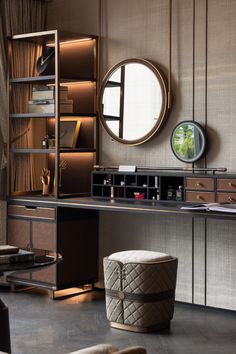 an elegant dressing table with mirror and stools in a room that is well lit