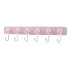 a pink and white coat rack with five hooks on each hook, hanging from the wall