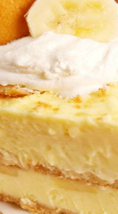 a piece of cheesecake with bananas and whipped cream