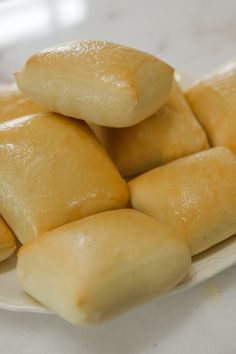 several pieces of bread sitting on top of a white plate