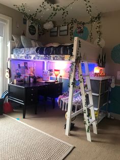 a room with bunk beds, desks and ladder in the middle is lit up by purple lights