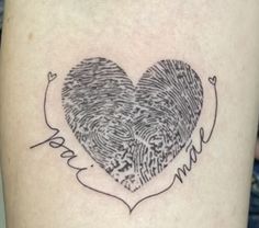 a heart shaped fingerprint tattoo on the leg