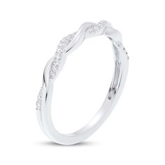 a white gold wedding ring with three diamonds on the side and an intricate design in the middle