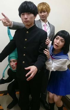 three people dressed in costumes posing for the camera