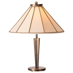 a table lamp with a white shade on it's base and a gold finish