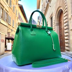 "This bag has been made of the best genuine leather by local master crafters of Florence in Italy, designed for women who only accept premium Italian quality and luxury leather bags and modern Italian fashion. . Size: Height: 28 cm/11.02 inches. Width: 33 cm/12.99 inches. Depth: 15 cm/ 5.91 inches. Color: Green . The story of this bag:  In the heart of Italy, where artistry and craftsmanship have flourished for centuries, a group of skilled artisans pours their passion into creating exquisite leather handbags. Among these masterpieces is \"The Florence Elegance,\" a handcrafted Italian leather bag that epitomizes style, grace, and practicality. This bag is more than just an accessory; it's a gift for her, a daily companion, and the perfect gift for Mom. It boasts the essence of Italian fas Luxury Green Briefcase For Daily Use, Luxury Green Bag For Business, Luxury Green Bag With Smooth Grain, Luxury Green Smooth Grain Shoulder Bag, Luxury Green Bag With Leather Lining, High-end Bags With Leather Lining For Daily Use, Green Office Bags With Leather Lining, Luxury Satchel With Smooth Grain For Shopping, Elegant Green Briefcase For Travel