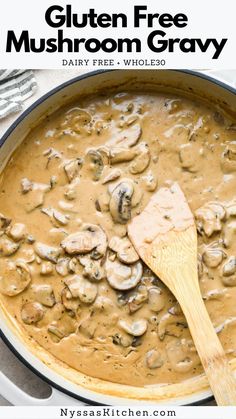 a pan filled with mushroom gravy and a wooden spoon