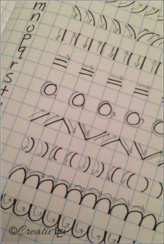 the letters and numbers are drawn on graph paper