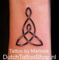 tattoo by marloes dutch tattooshop on the wrist and arm, with an intertwined