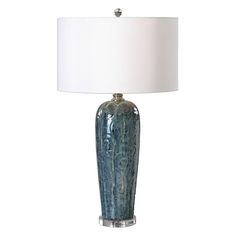 a blue lamp with a white shade on it