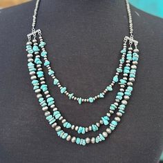 Glam up your look with this one-of-a-kind necklace featuring layers of turquoise stones and Navajo pearls! Whether you're ready to hit the town or just catching up with friends, this statement-making piece will have you looking sharp and feeling comfortably chic! LENGTH: 13" ADJUSTABLE CHAIN: 4" Maria Necklace, Catching Up With Friends, Navajo Pearls, Turquoise Stones, Turquoise Stone, Turquoise, With Friends, Beads, Chain