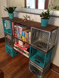 a bookshelf filled with lots of books on top of a wooden floor