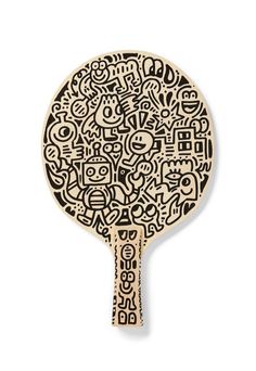 a wooden paddle with black and white designs on it