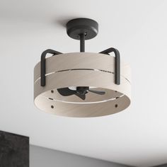 a modern ceiling light in a room with white walls and black accents on the ceiling