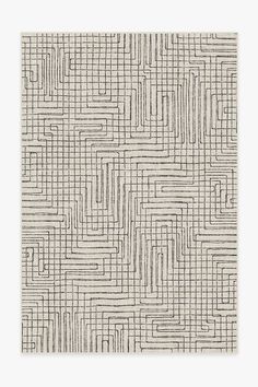 a white and black rug with an abstract design on the bottom half, in grey tones