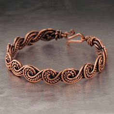 The bracelet is made of pure copper wire. The copper is artificially aged with patination, which gives an antique look and makes the details of the bracelet more expressive. After patination, the bracelet was polished to a shine, which gives a beautiful aesthetic appearance to the bracelet. The bracelet is covered with a protective varnish to prevent darkening.You will receive the exact bracelet you see in the photos.The bracelet can be combined with any wardrobe and emphasize your uniqueness and style. Bracelet Width: 0.4" (1 cm)  PLEASE NOTEChoose the desired length of the bracelet from the suggested options. To correctly choose the size of the bracelet, you need to add 0.6" (1.5 cm) to the size of your wrist girth. You will get the length of the bracelet that suits you.For example. If y Copper Jewelry Diy, Metal Art Jewelry, Wire Jewelry Patterns, Wire Crochet Jewelry, Wire Wrap Jewelry Designs, Wire Jewelry Making, Wire Wrapped Bangles, Copper Wire Jewelry, Wire Jewelry Tutorial