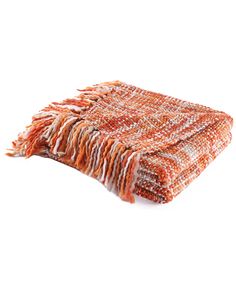 an orange and white blanket with fringes on it's end, against a white background