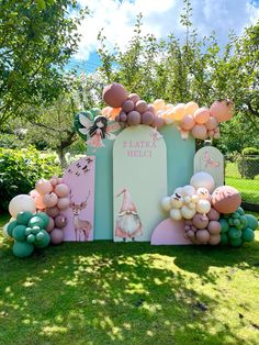 a balloon arch in the shape of a house with balloons attached to it's sides