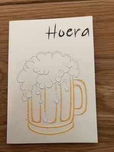 a piece of paper with a drawing of a mug of beer on it