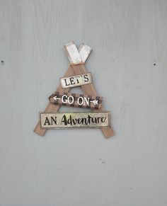 two wooden signs that say let's go on and an adventure