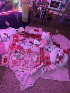 a hello kitty themed birthday party is set up on the floor