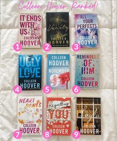 twelve books are arranged on a bed with pink and blue lettering in each bookmark