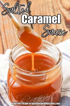 a spoon full of sauce being poured into a jar with the words salted caramel sauce