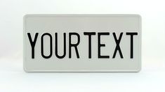 a white and black sign that says your text