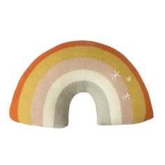 an orange, yellow and white knitted rainbow pillow