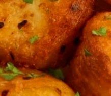 some food that is sitting on top of a plate with green leaves in the middle